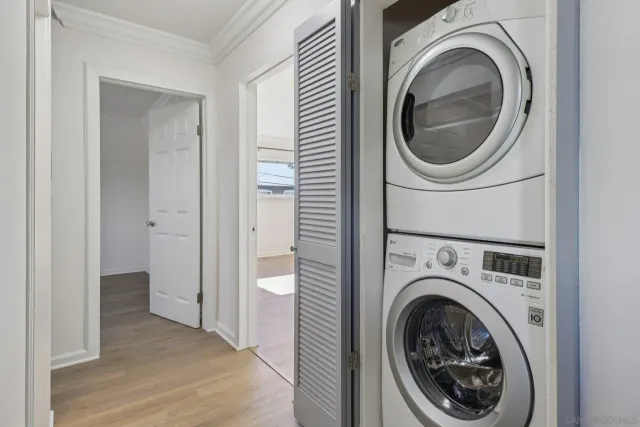 a view of a hallway with washer and dryer