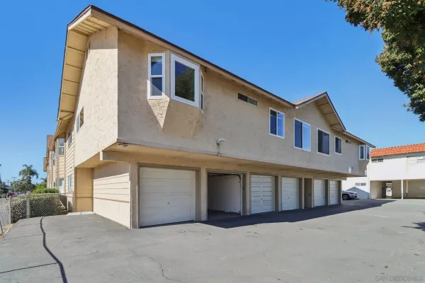 a front view of a house with garage