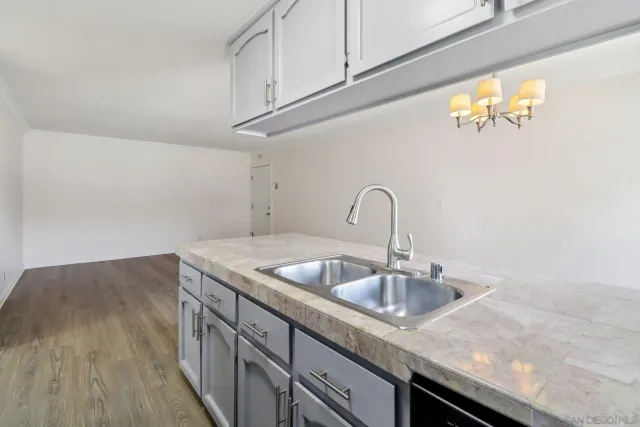 a kitchen with a sink and cabinets