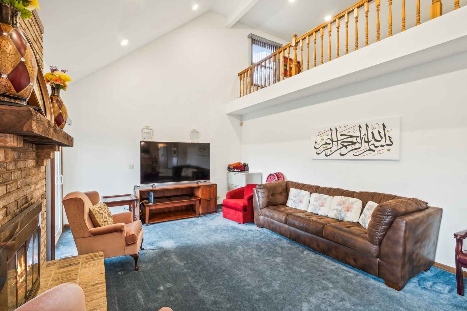 1605 Charlemagne Drive Hoffman Estates, IL 60192 - Photo 12 of 29 a living room with furniture and a flat screen tv