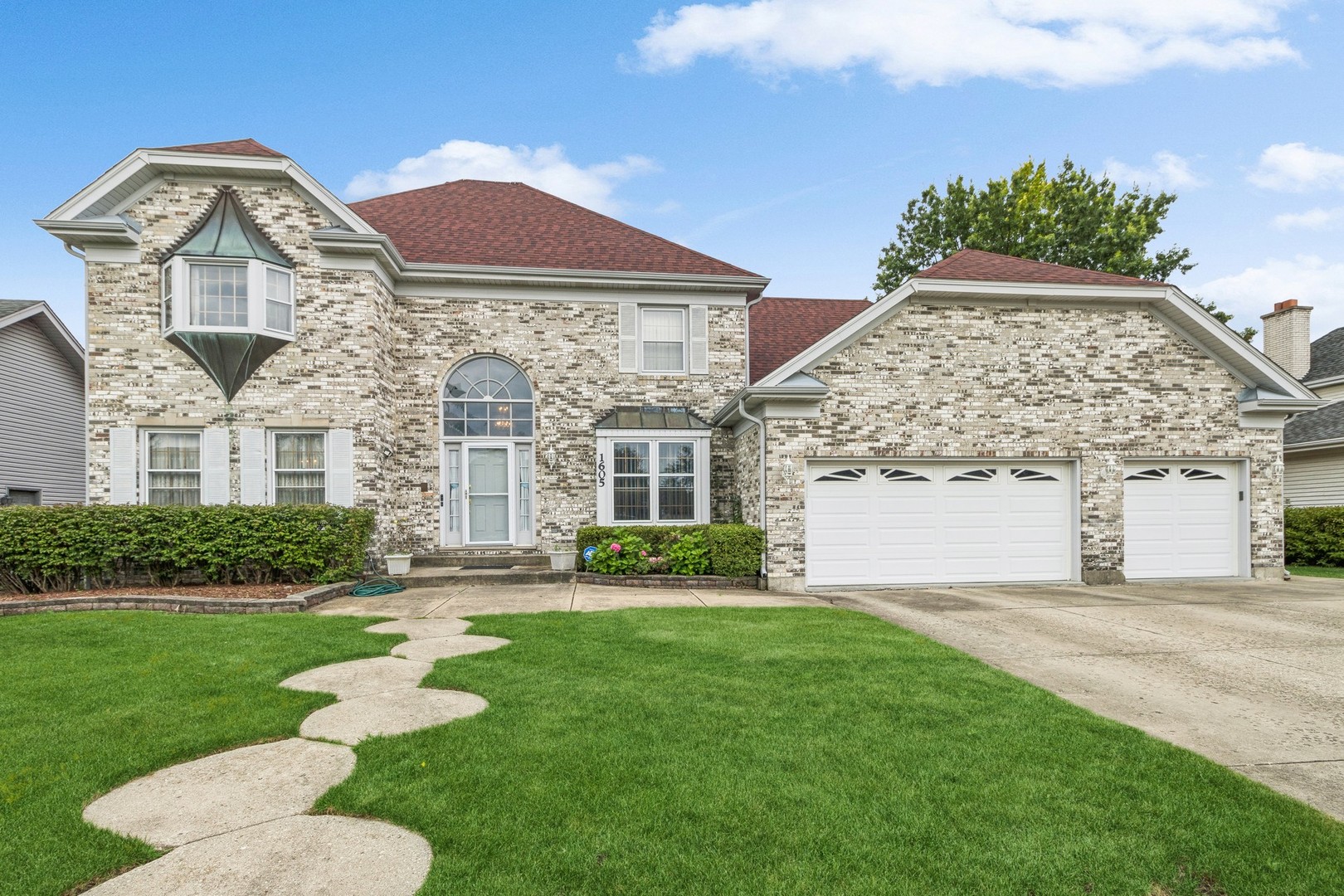 1605 Charlemagne Drive Hoffman Estates, IL 60192 - Photo 2 of 29 front view of a house with a yard
