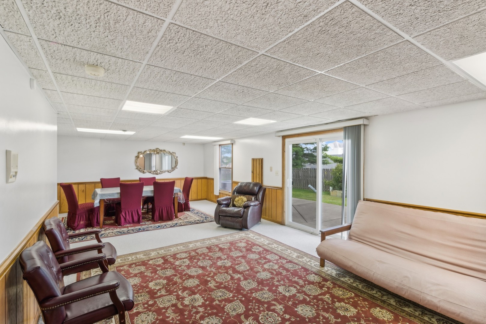 1605 Charlemagne Drive Hoffman Estates, IL 60192 - Photo 22 of 29 a living room with furniture and a large window