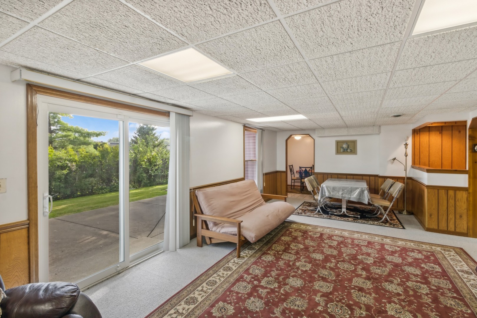 1605 Charlemagne Drive Hoffman Estates, IL 60192 - Photo 24 of 29 a living room with furniture and a flat screen tv