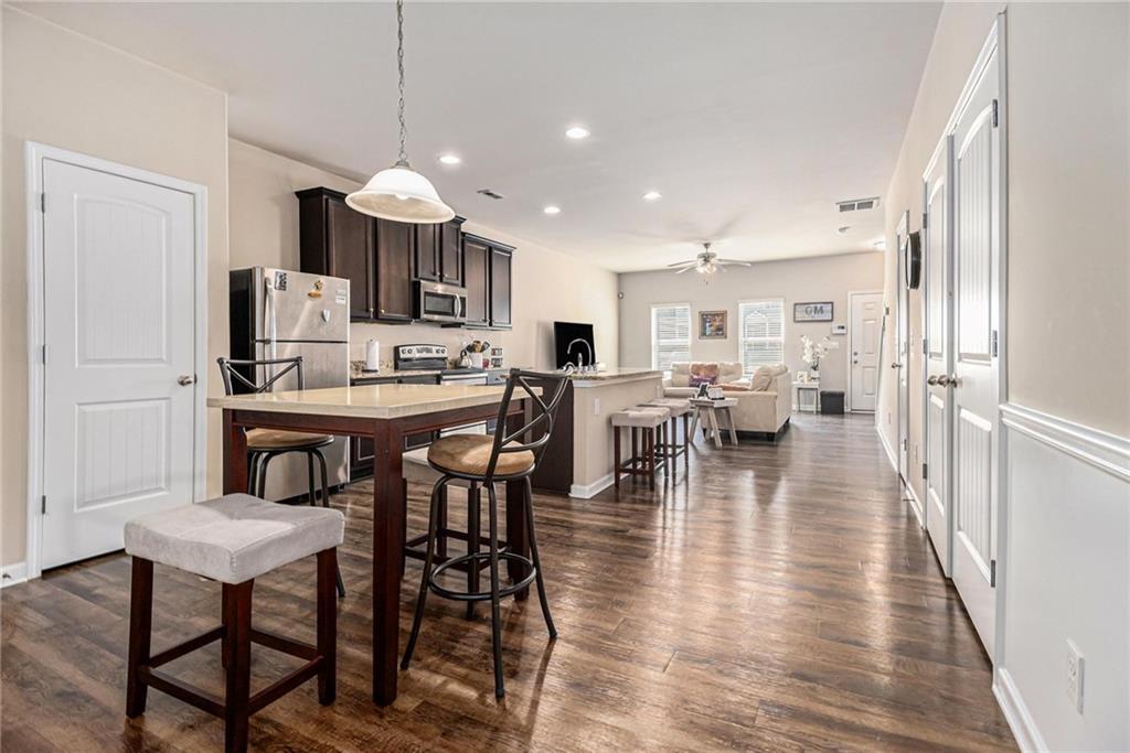 6148 Oakley Road, Unit 23 Union City, GA 30291 - Photo 12 of 26 a view of a dining room with furniture and wooden floor
