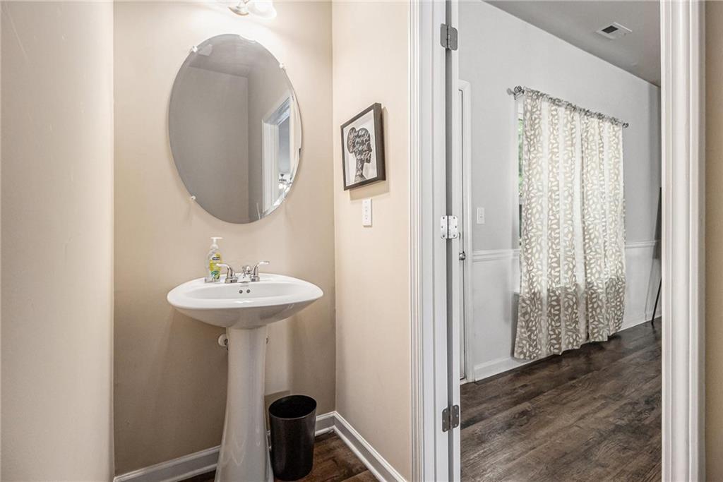 6148 Oakley Road, Unit 23 Union City, GA 30291 - Photo 14 of 26 a bathroom with a sink and a mirror