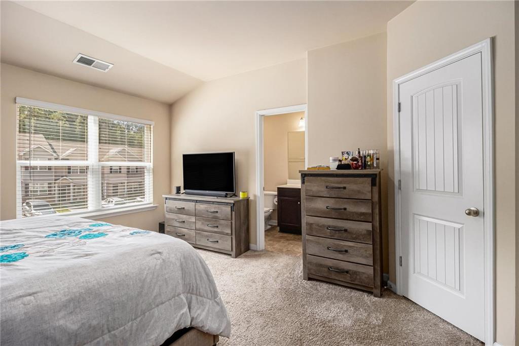 6148 Oakley Road, Unit 23 Union City, GA 30291 - Photo 17 of 26 a bedroom with a bed and furniture