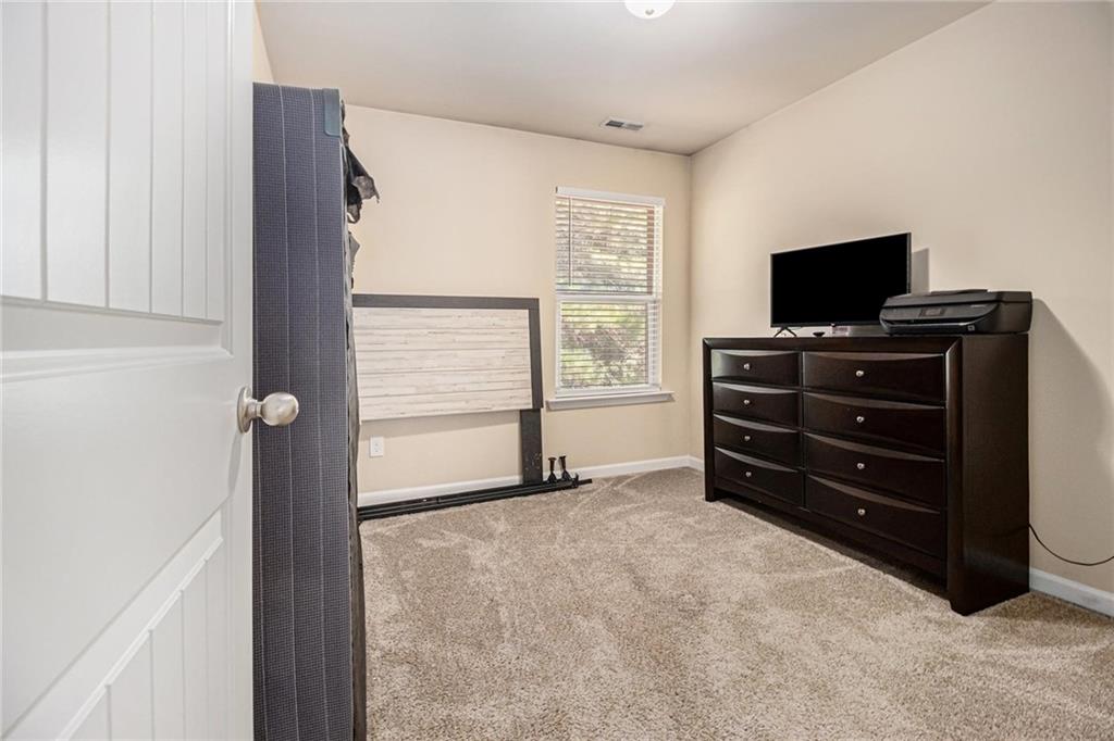 6148 Oakley Road, Unit 23 Union City, GA 30291 - Photo 22 of 26 a living room with furniture and a flat screen tv