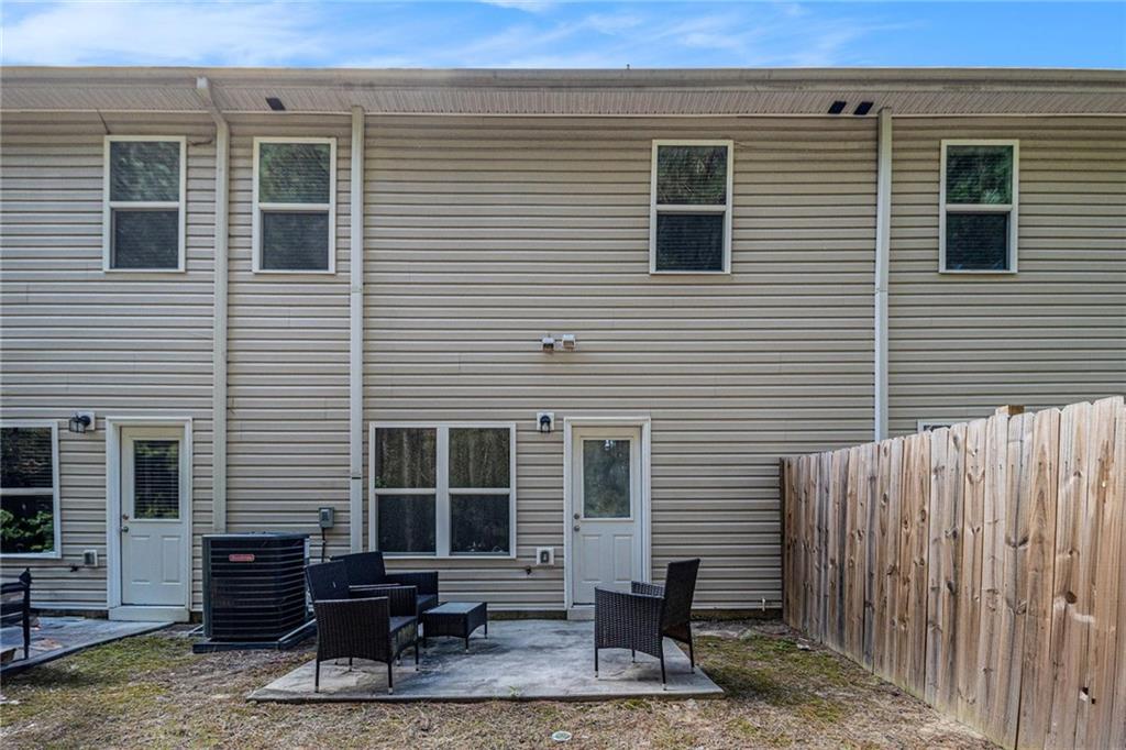 6148 Oakley Road, Unit 23 Union City, GA 30291 - Photo 25 of 26 a view of a house with a backyard and a chair
