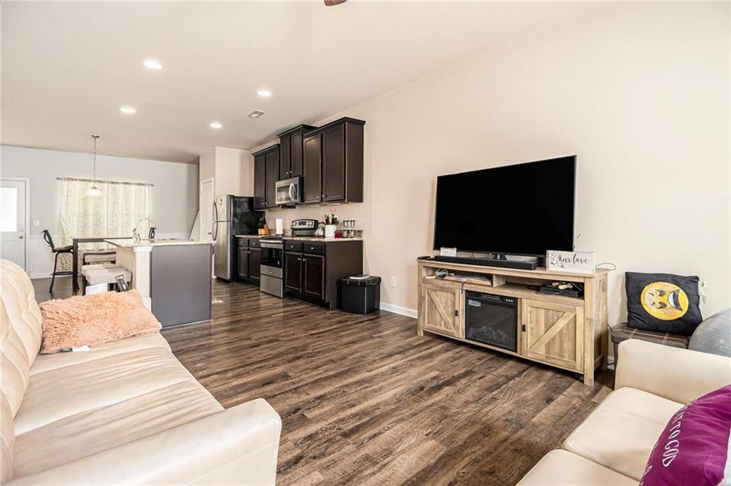 6148 Oakley Road, Unit 23 Union City, GA 30291 - Photo 8 of 26 a living room with furniture and a flat screen tv