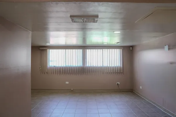 a view of an empty room and window