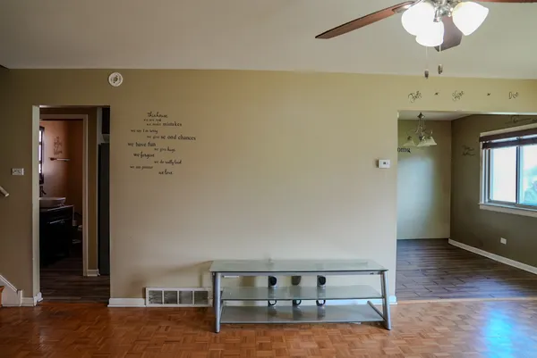 a view of a livingroom with wooden floor