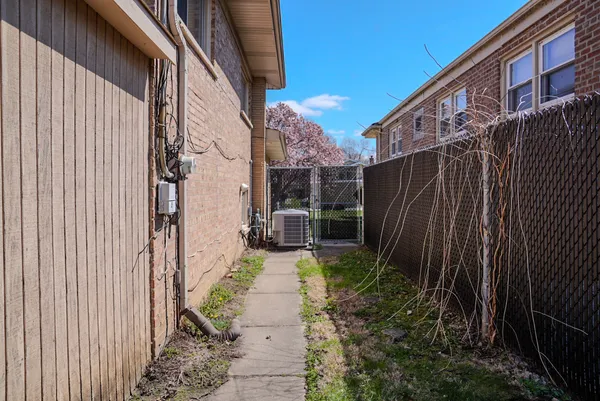 a view of a pathway with a backyard