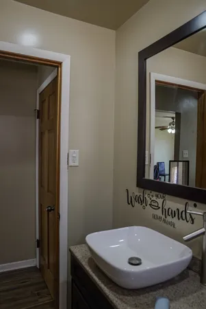 a bathroom with a sink and a mirror