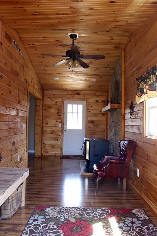1645 Main Road Granville, MA 01034 - Photo 3 of 20 a living room with fireplace furniture and a wooden floor