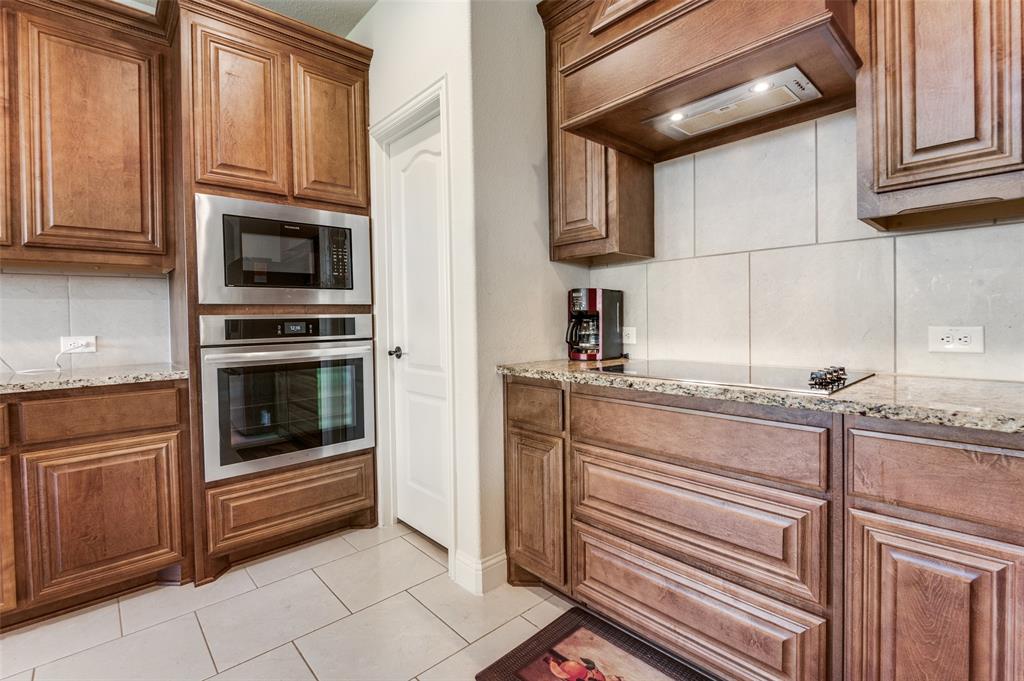 3822 Myrtle Way Kaufman, TX 75142 - Photo 13 of 39 a kitchen with granite countertop cabinets stainless steel appliances and a sink