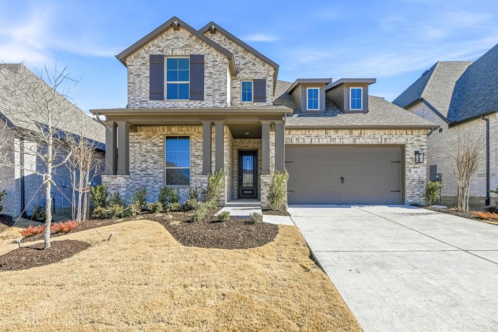 4118 Windy Point Court Oak Point, TX 75068 - Photo 1 of 1 a front view of a house with garden