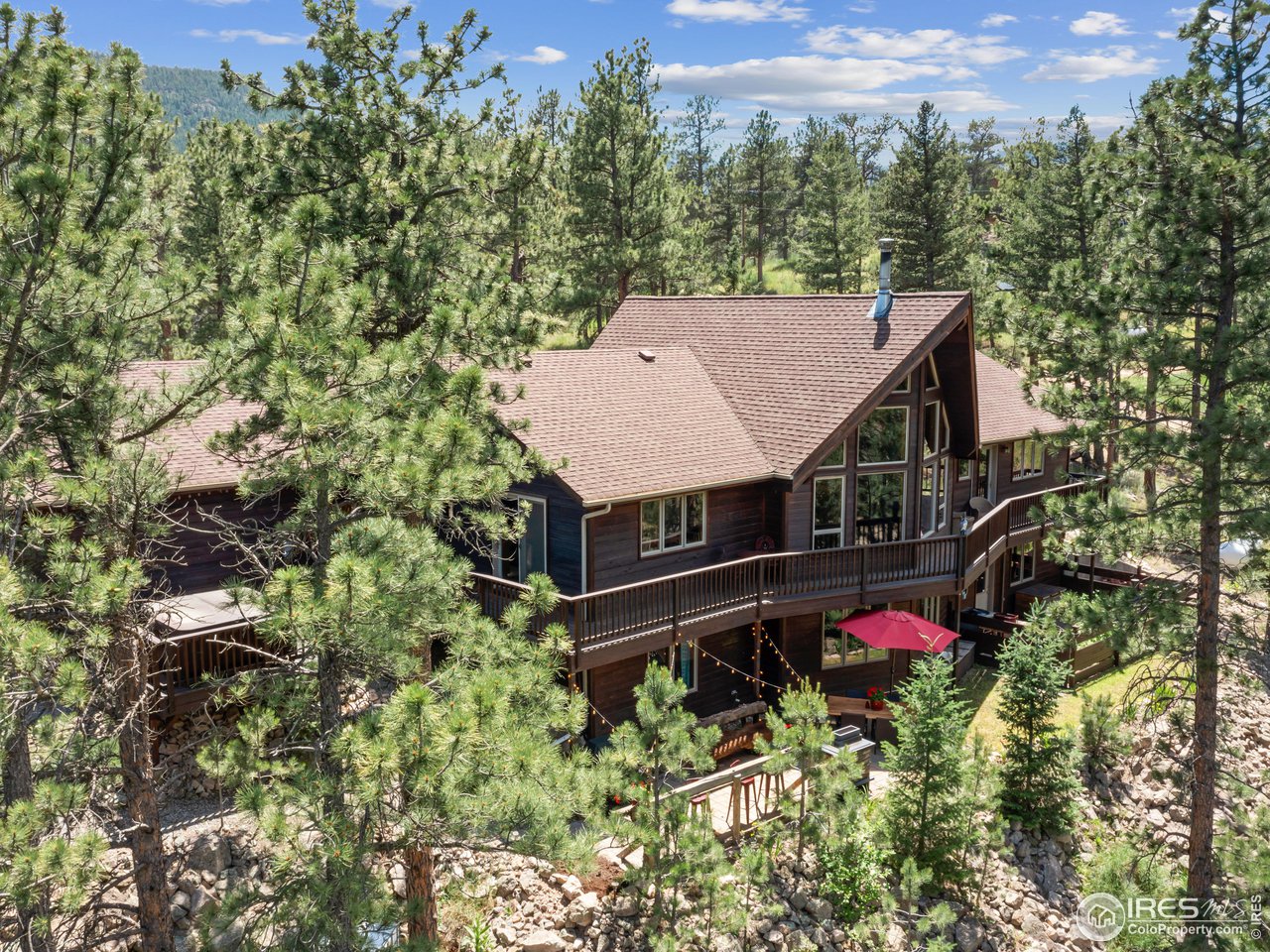 287 Wichita Road Lyons, CO 80540 - Photo 2 of 40 an aerial view of a house with a yard