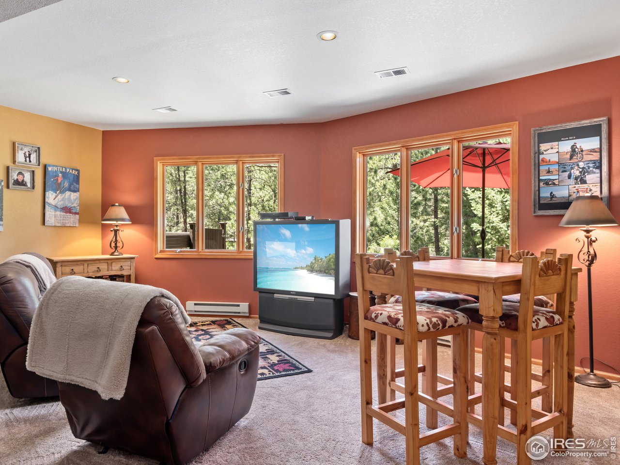 287 Wichita Road Lyons, CO 80540 - Photo 25 of 40 a living room with furniture and a flat screen tv