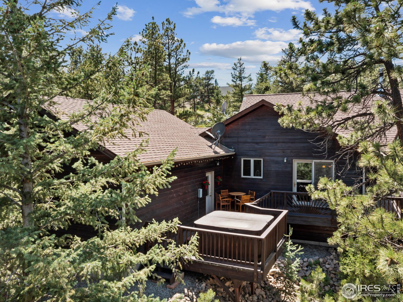 287 Wichita Road Lyons, CO 80540 - Photo 29 of 40 a front view of a house with a yard