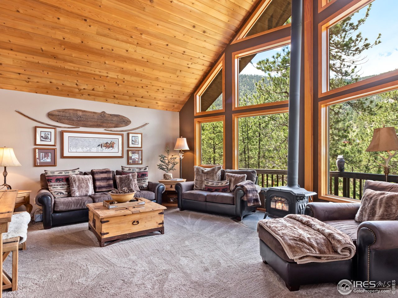 287 Wichita Road Lyons, CO 80540 - Photo 3 of 40 a living room with furniture and a large window