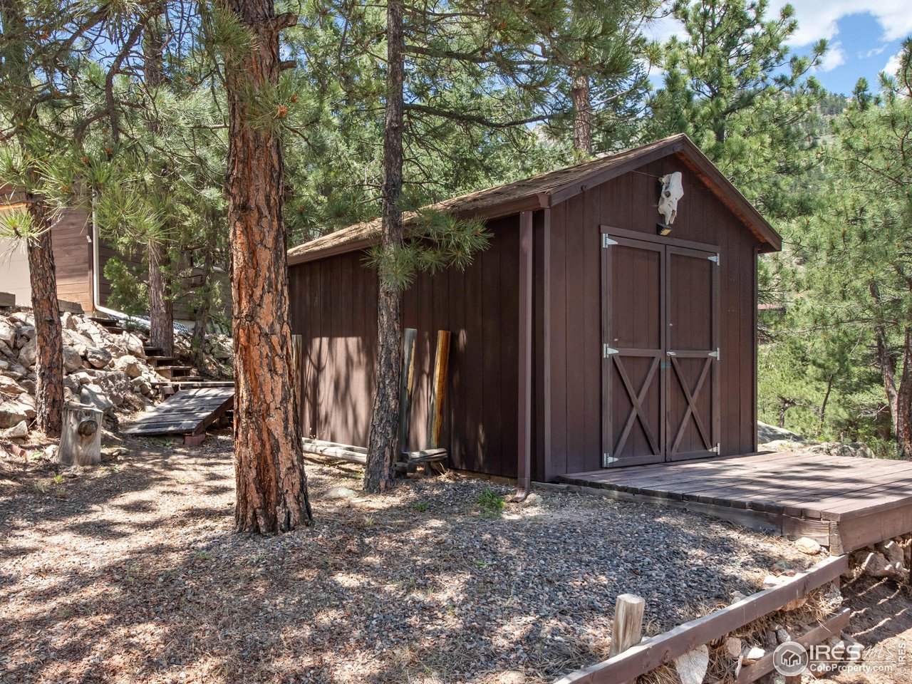 287 Wichita Road Lyons, CO 80540 - Photo 31 of 40 a view of a house with a yard
