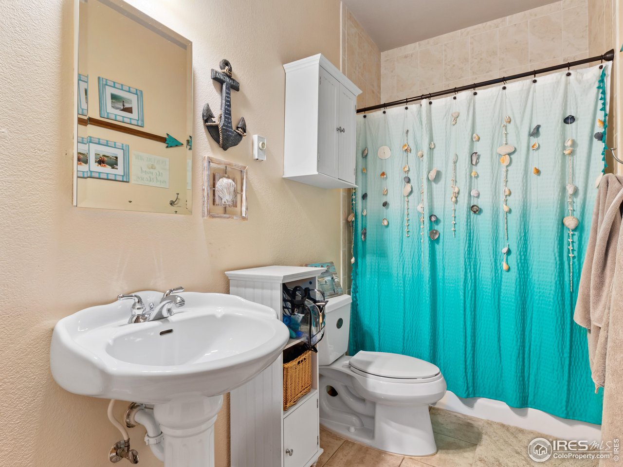 287 Wichita Road Lyons, CO 80540 - Photo 32 of 40 a bathroom with a sink a toilet and a mirror