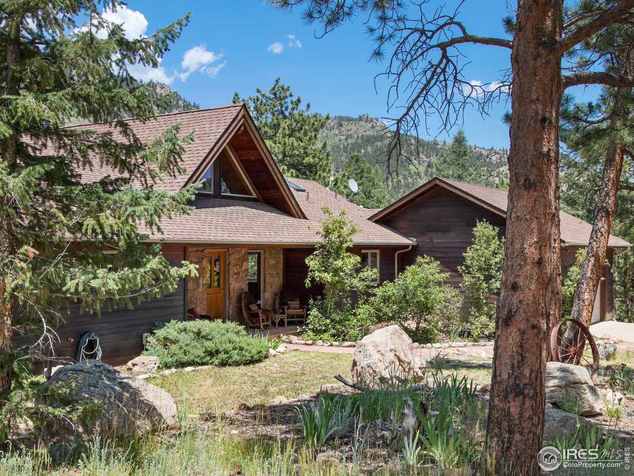 287 Wichita Road Lyons, CO 80540 - Photo 34 of 40 a front view of a house with garden