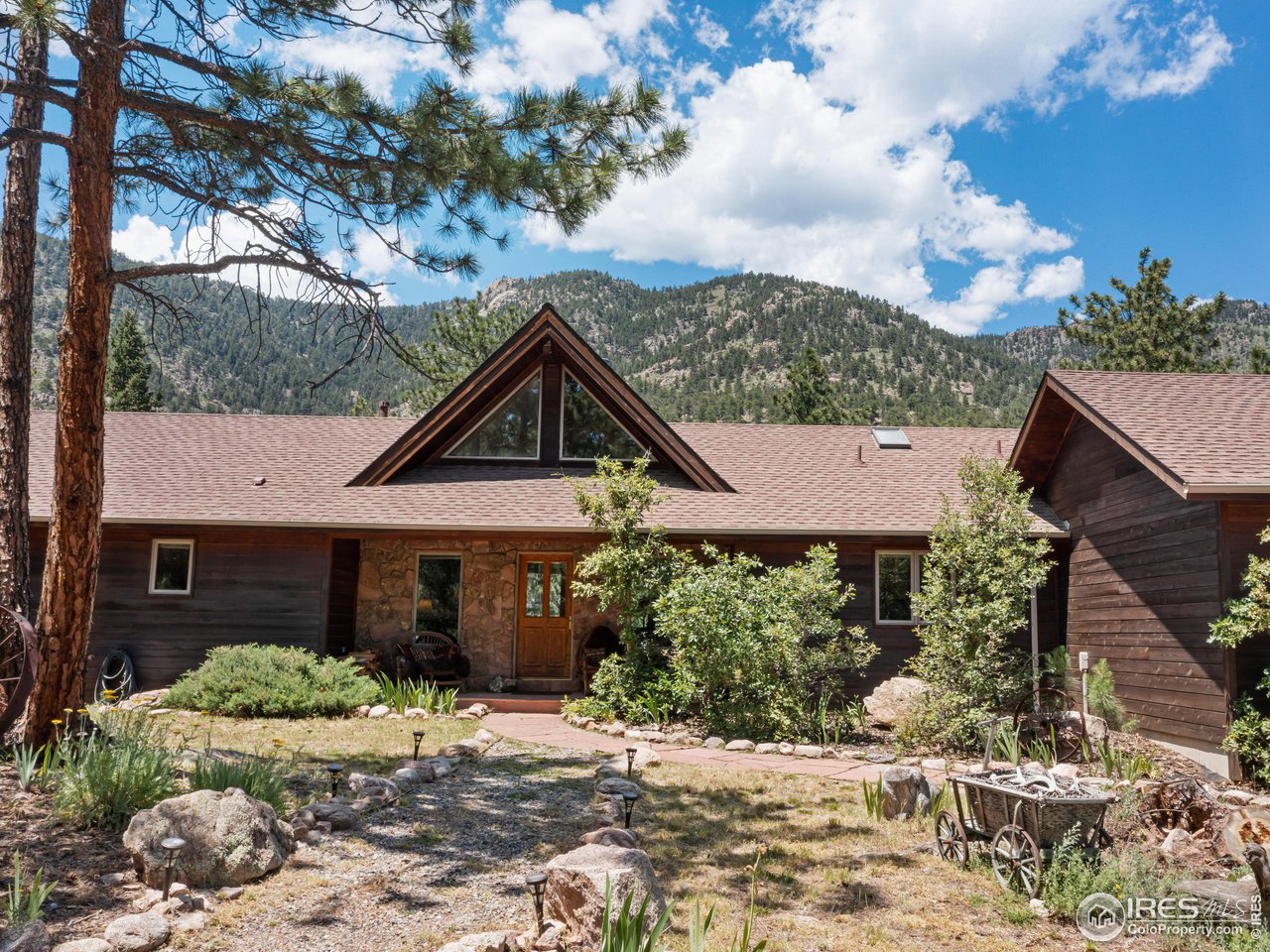 287 Wichita Road Lyons, CO 80540 - Photo 37 of 40 a front view of a house with garden