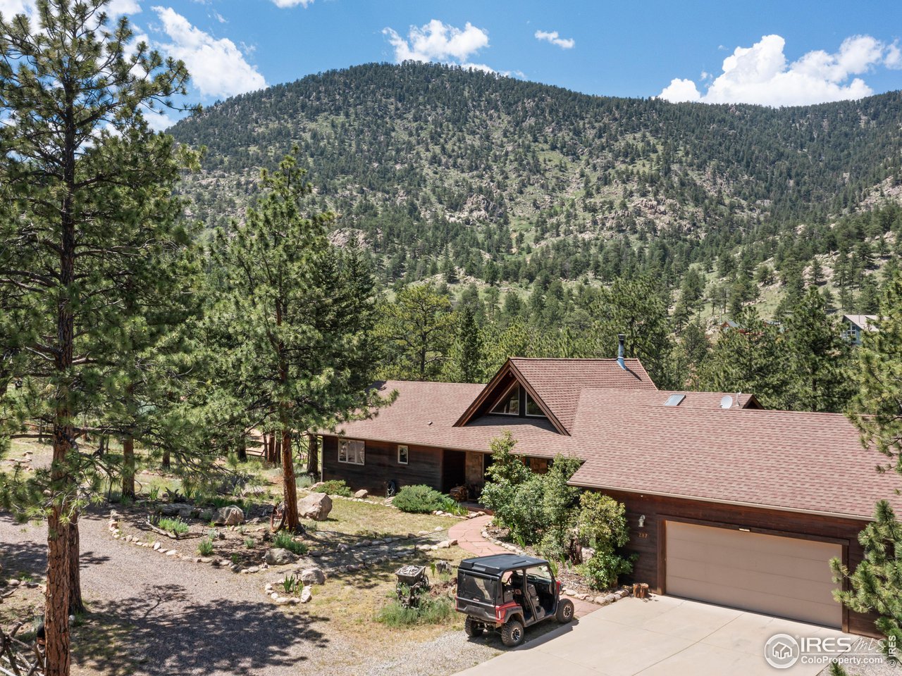 287 Wichita Road Lyons, CO 80540 - Photo 38 of 40 a front view of a house with a yard