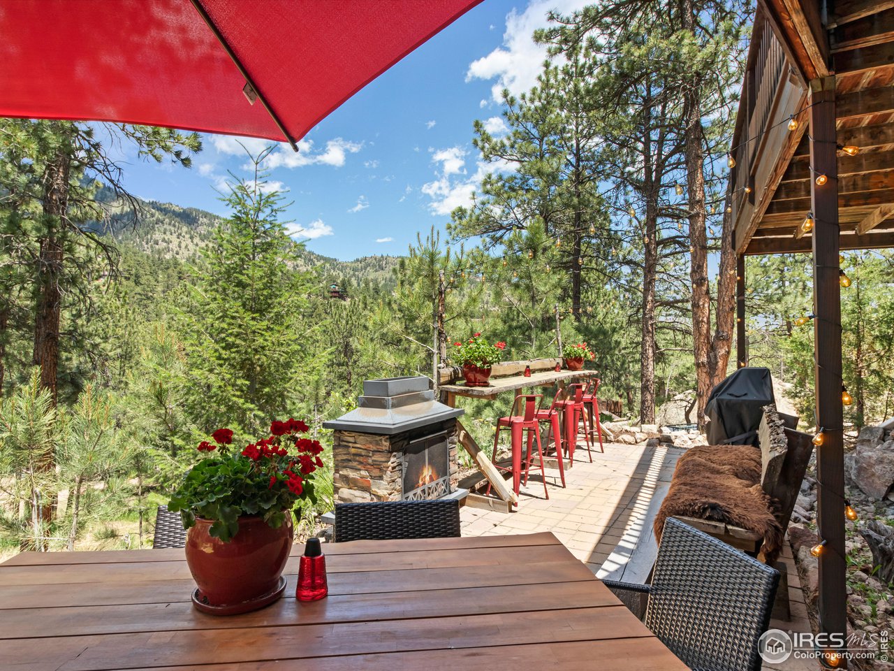 287 Wichita Road Lyons, CO 80540 - Photo 5 of 40 a view of a chairs and table in the patio