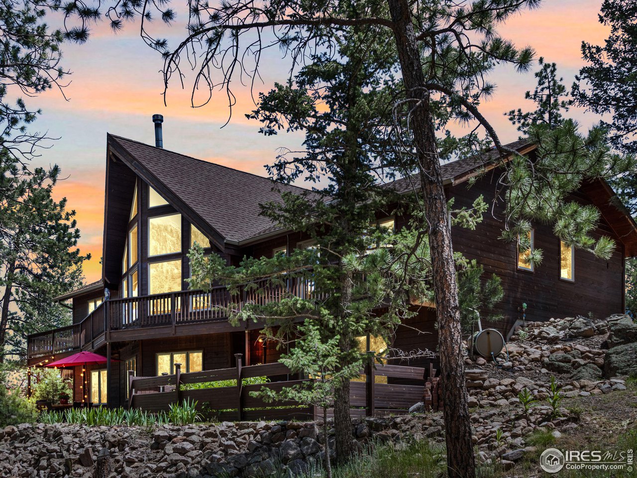 287 Wichita Road Lyons, CO 80540 - Photo 8 of 40 a view of a house with a tree