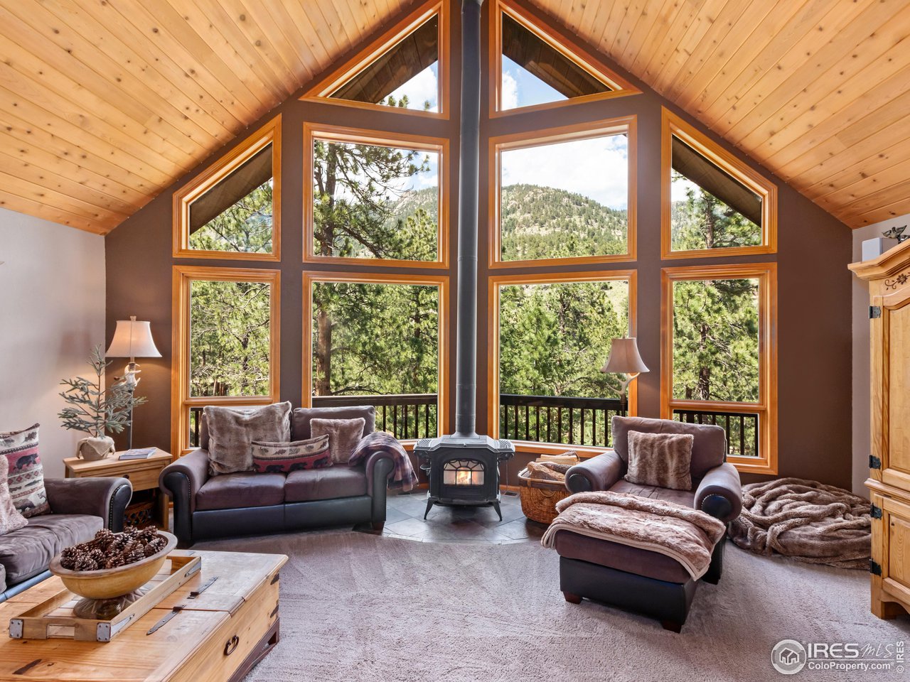 287 Wichita Road Lyons, CO 80540 - Photo 9 of 40 a living room with furniture and a large window