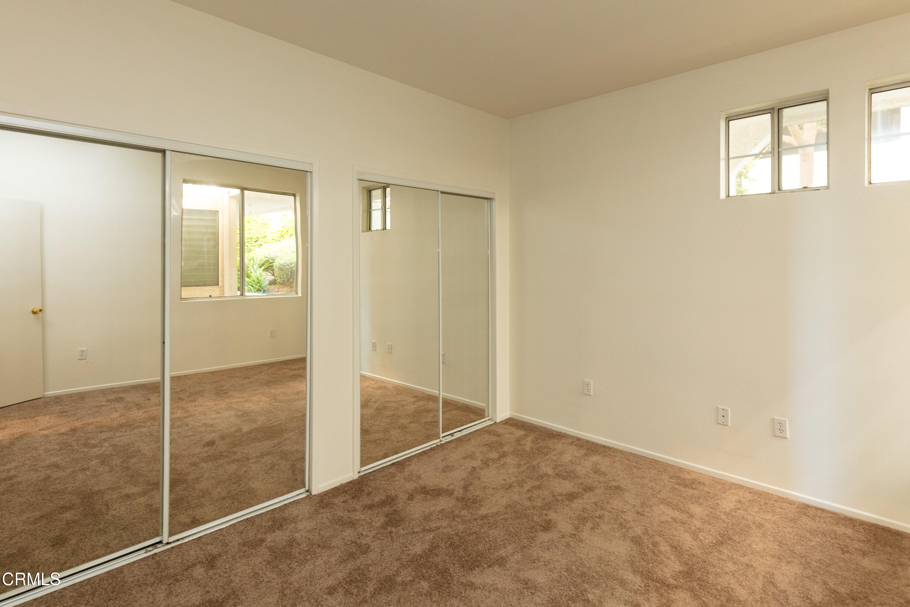 2913 Antonio Drive, Unit 106 Camarillo, CA 93010 - Photo 11 of 14 an empty room with sliding glass door