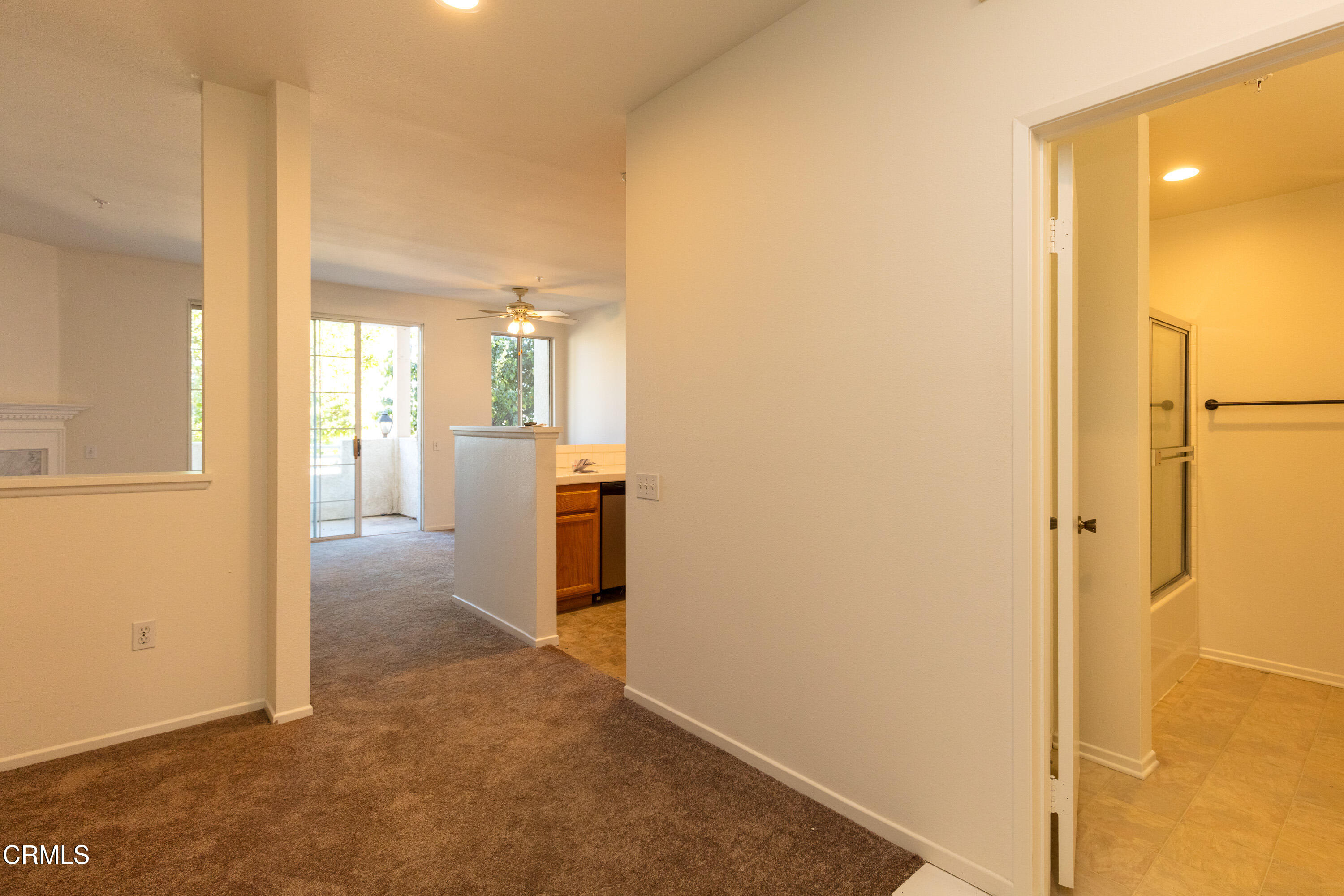 2913 Antonio Drive, Unit 106 Camarillo, CA 93010 - Photo 3 of 14 a view of a hallway with wooden floor