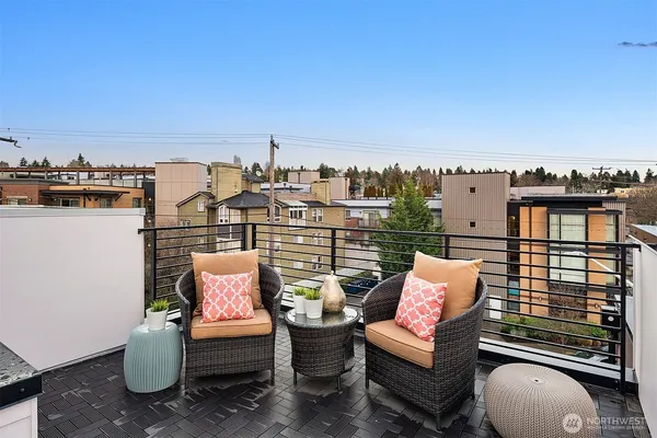 an outdoor living room with furniture