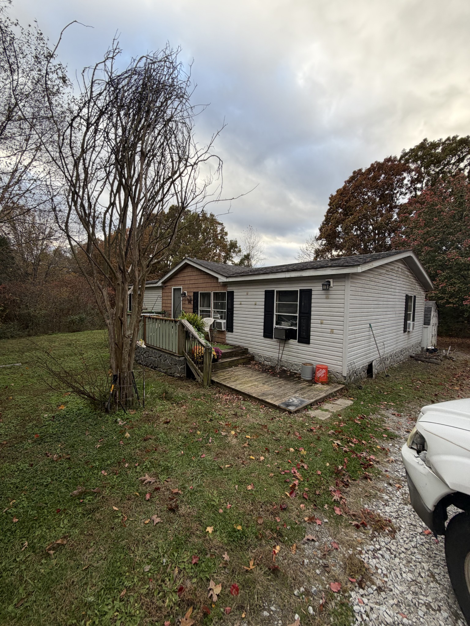 2749 Highway 47 White Bluff, TN 37187 - Photo 2 of 4 a view of a house with a chairs in a yard