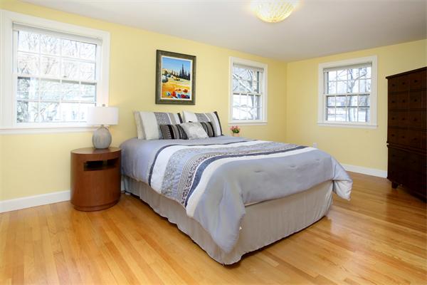 27 Haven Road Wellesley, MA 02481 - Photo 7 of 10 a bedroom with a bed lamp on desk and a window