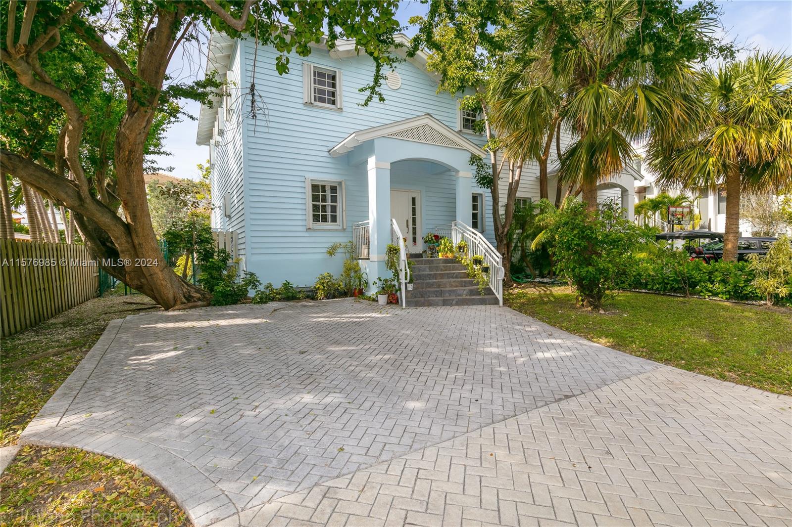 444 Fernwood Road, Unit 444 Key Biscayne, FL 33149 - Photo 1 of 28 a front view of a house with garden
