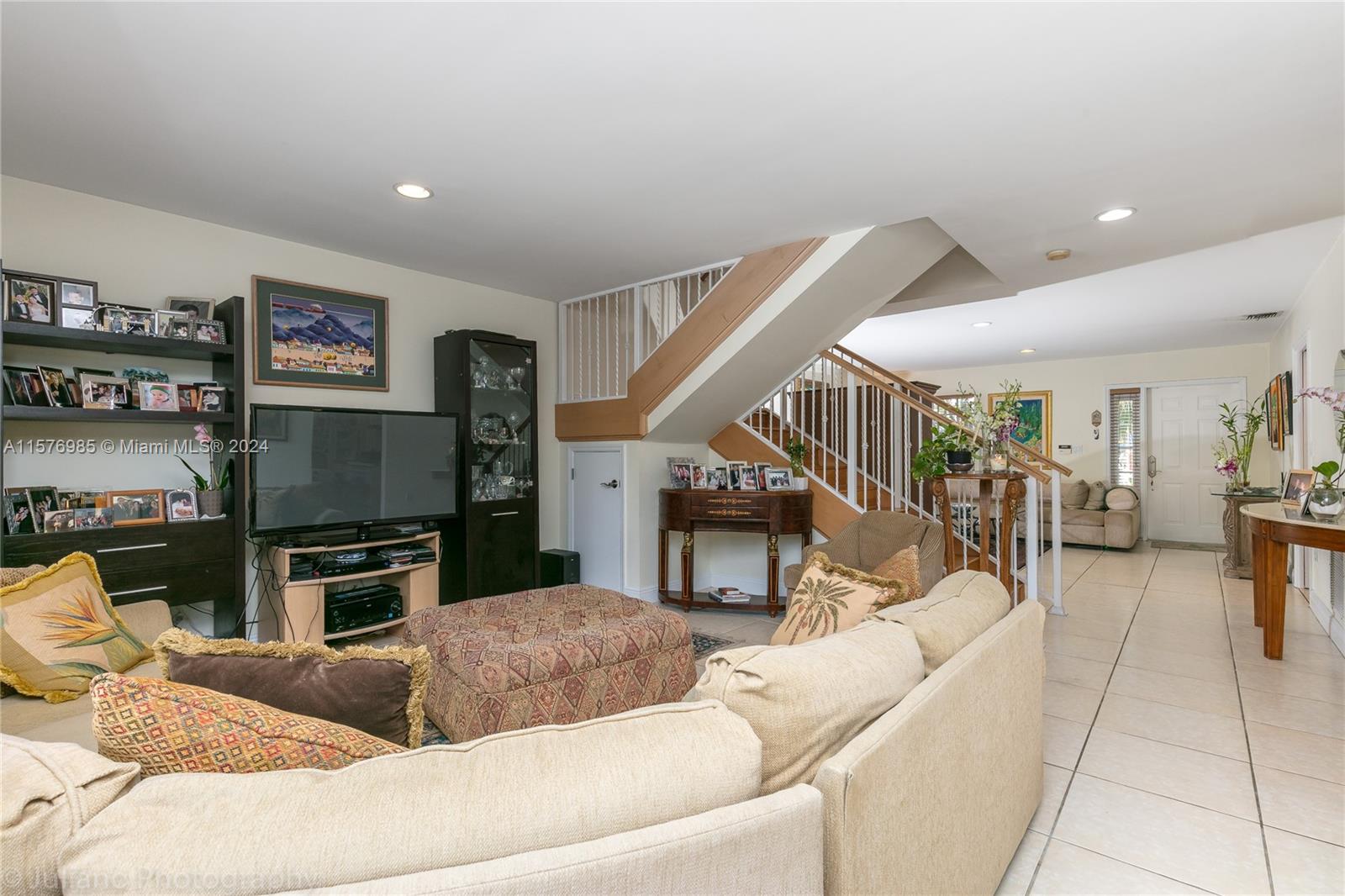 444 Fernwood Road, Unit 444 Key Biscayne, FL 33149 - Photo 11 of 28 a living room with furniture and a flat screen tv