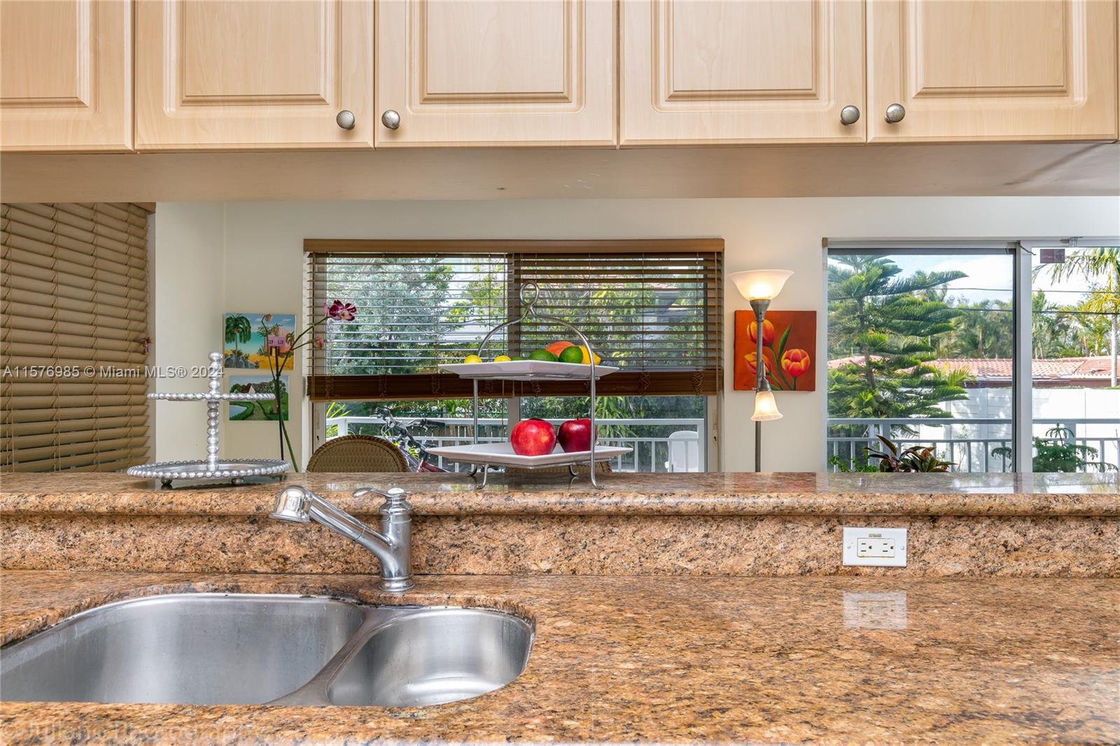 444 Fernwood Road, Unit 444 Key Biscayne, FL 33149 - Photo 18 of 28 a kitchen with a sink and a window