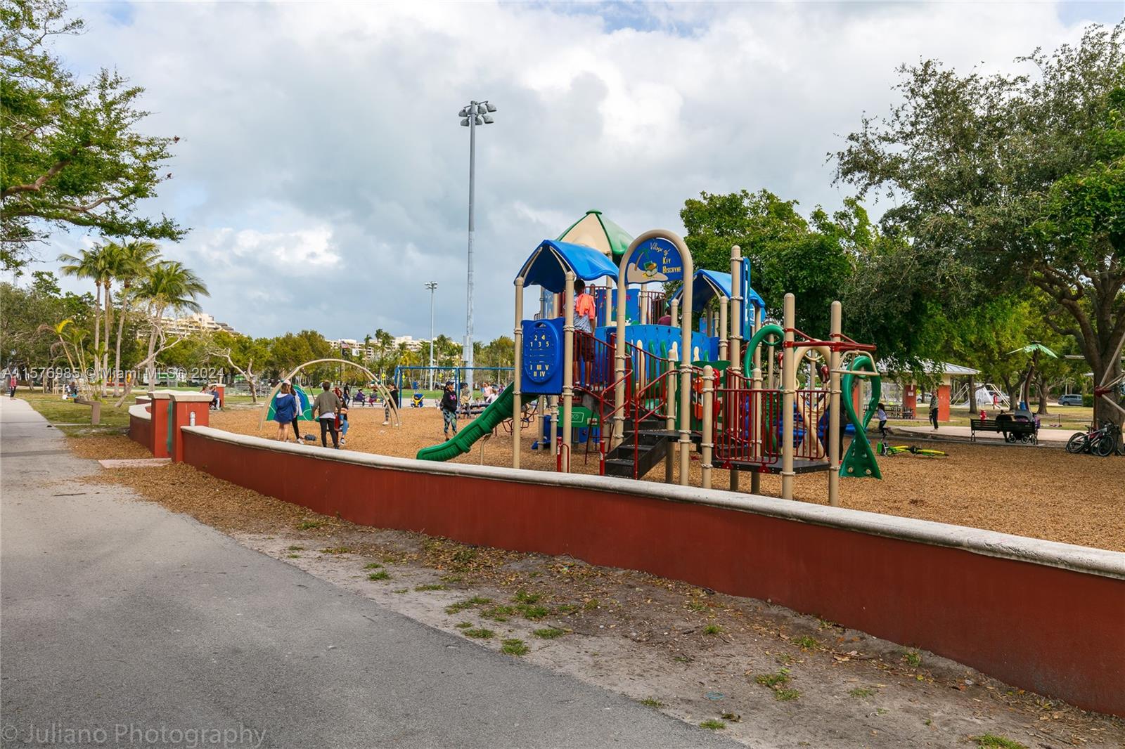 444 Fernwood Road, Unit 444 Key Biscayne, FL 33149 - Photo 7 of 28 a view of a street with cars parked on the road