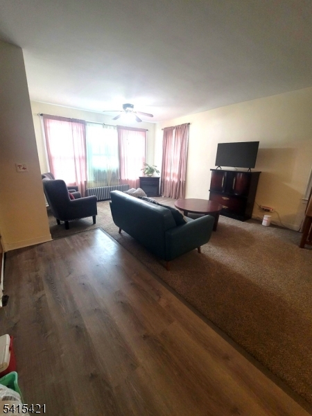 26 Harding Terrace Newark, NJ 07112 - Photo 3 of 6 a living room with furniture and a flat screen tv