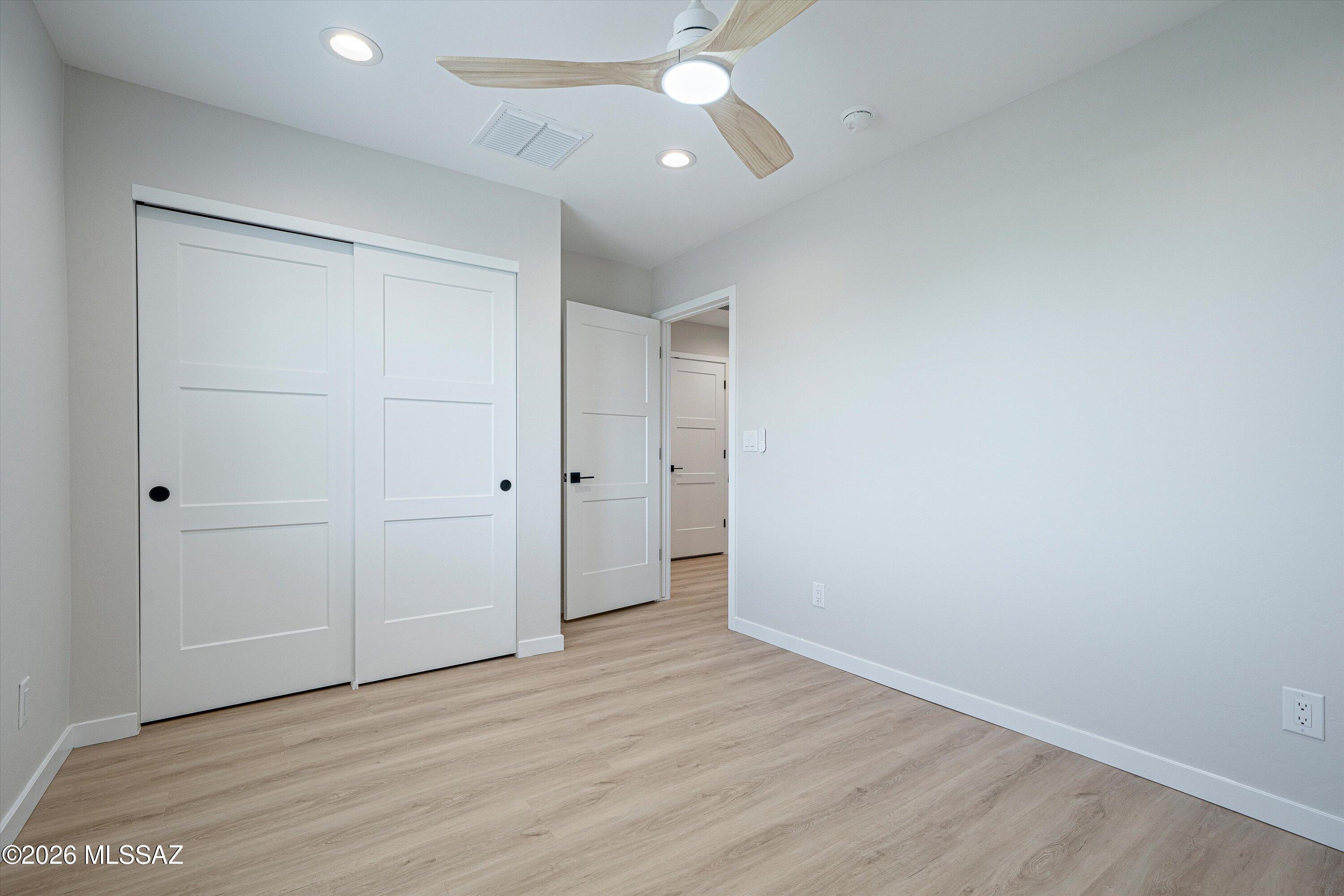 739 North Queen Avenue, Unit 2 Tucson, AZ 85705 - Photo 13 of 28 wooden floor in an empty room