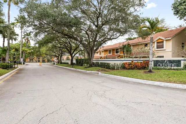 a view of house with a yard