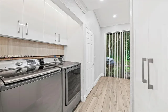a kitchen with a stove and a white cabinet