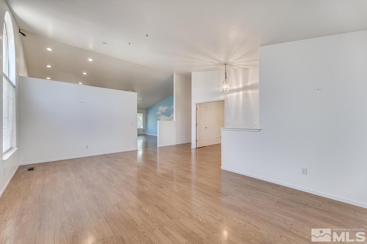 502 Silversmith Place Reno, NV 89511 - Photo 29 of 37 a view of empty room with wooden floor