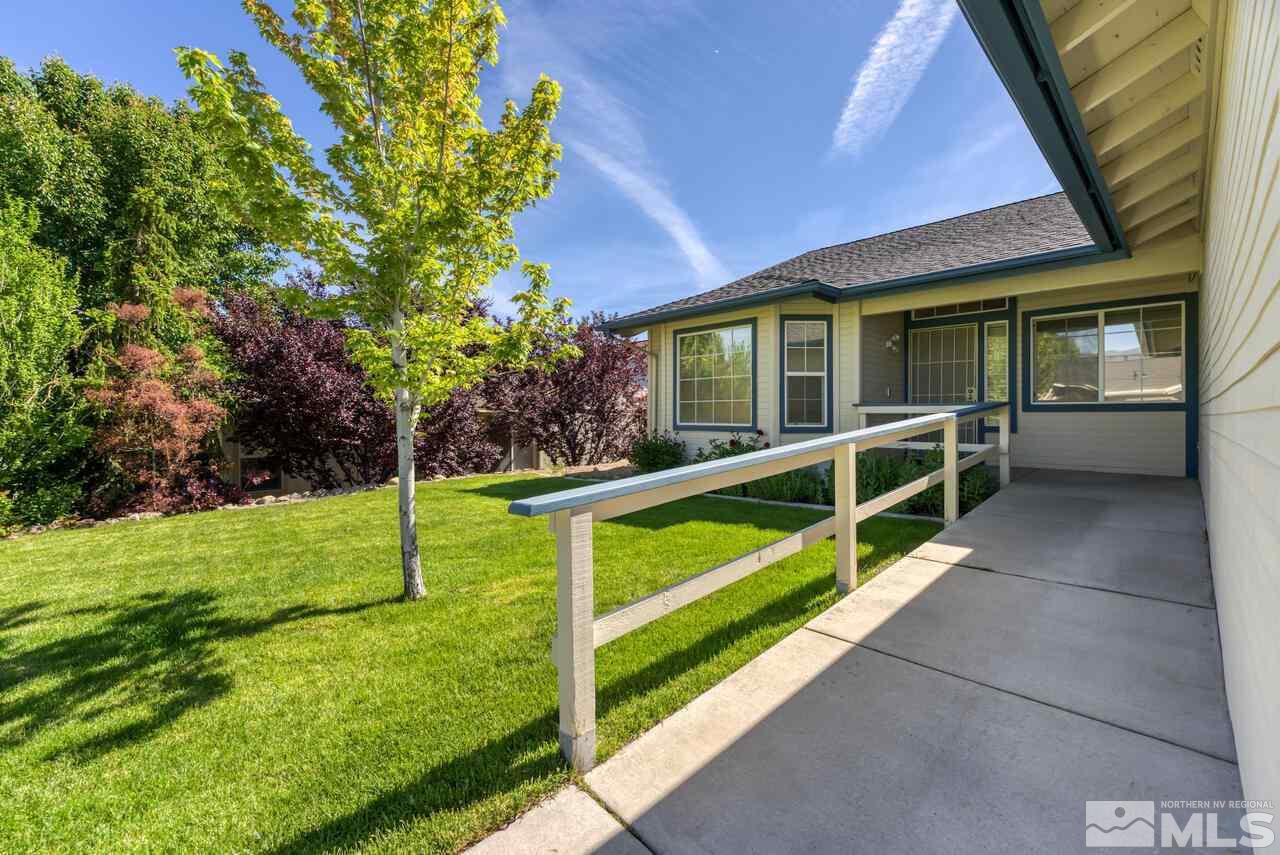 502 Silversmith Place Reno, NV 89511 - Photo 3 of 37 a view of an house with backyard and porch