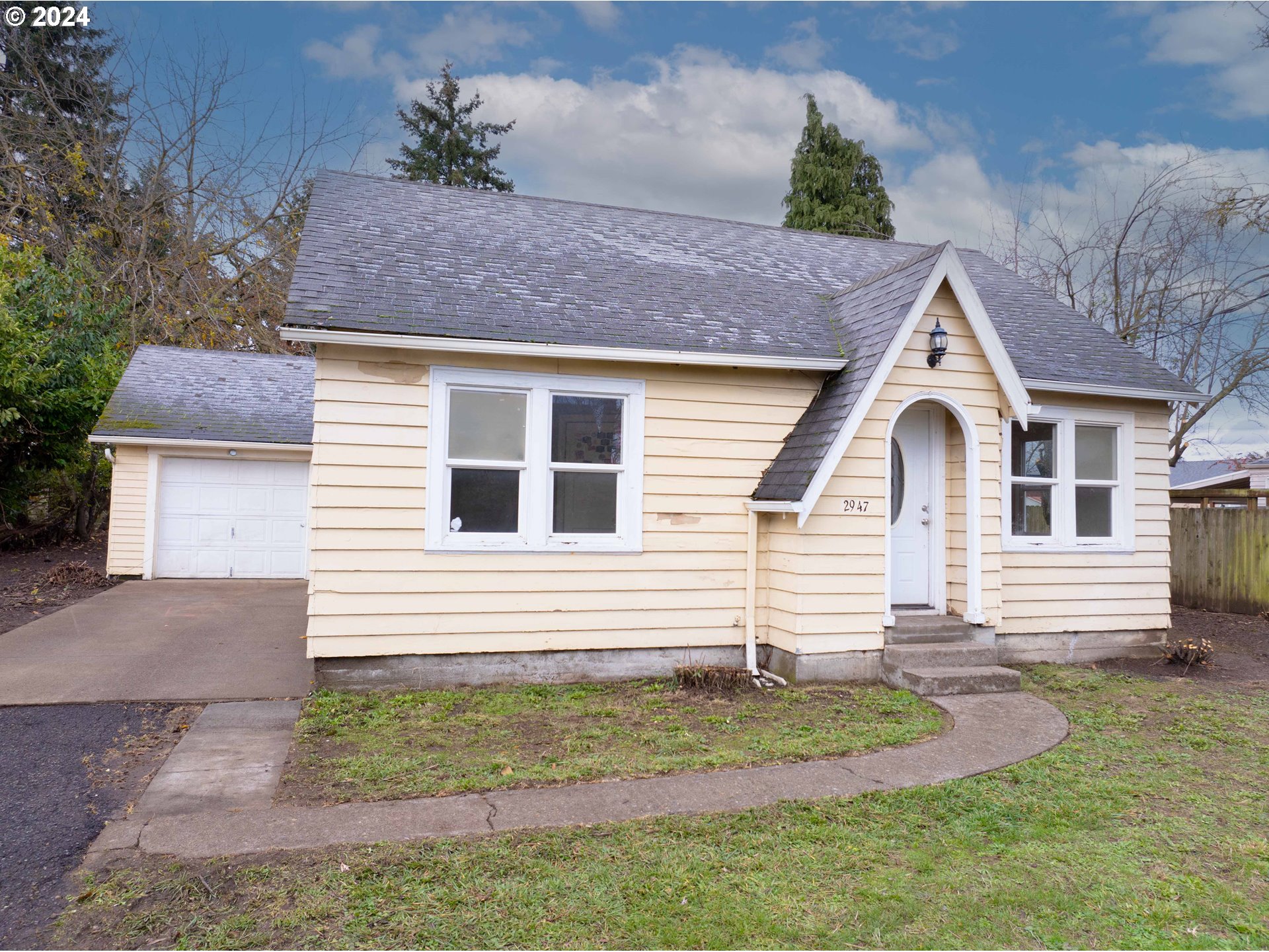 a house view with a garden space