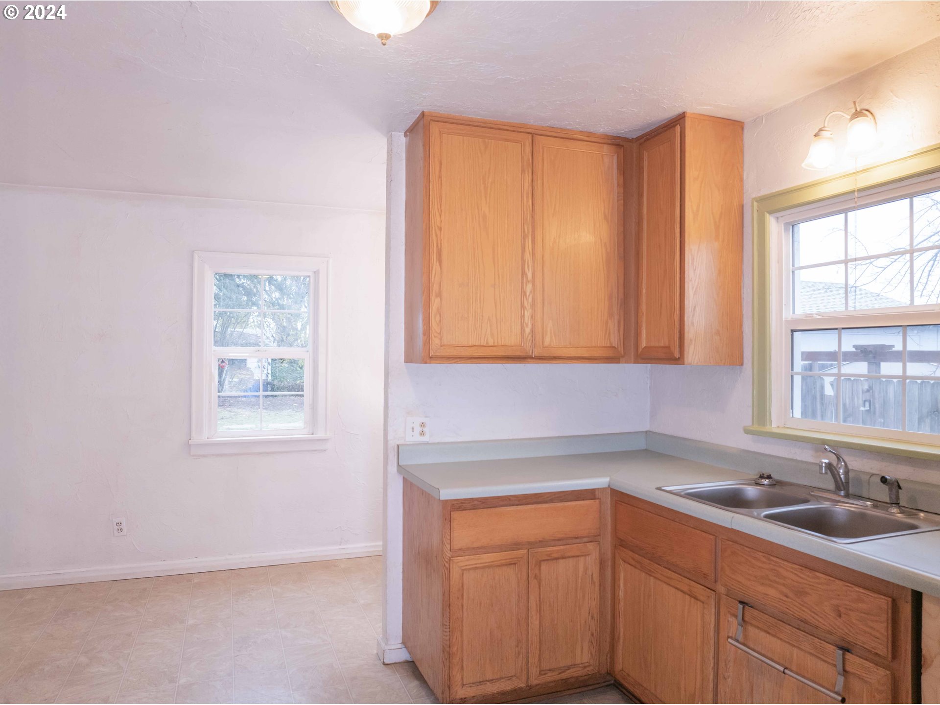 2947 Elmira Road Eugene, OR 97402 - Photo 12 of 29 a kitchen with a sink cabinets and window
