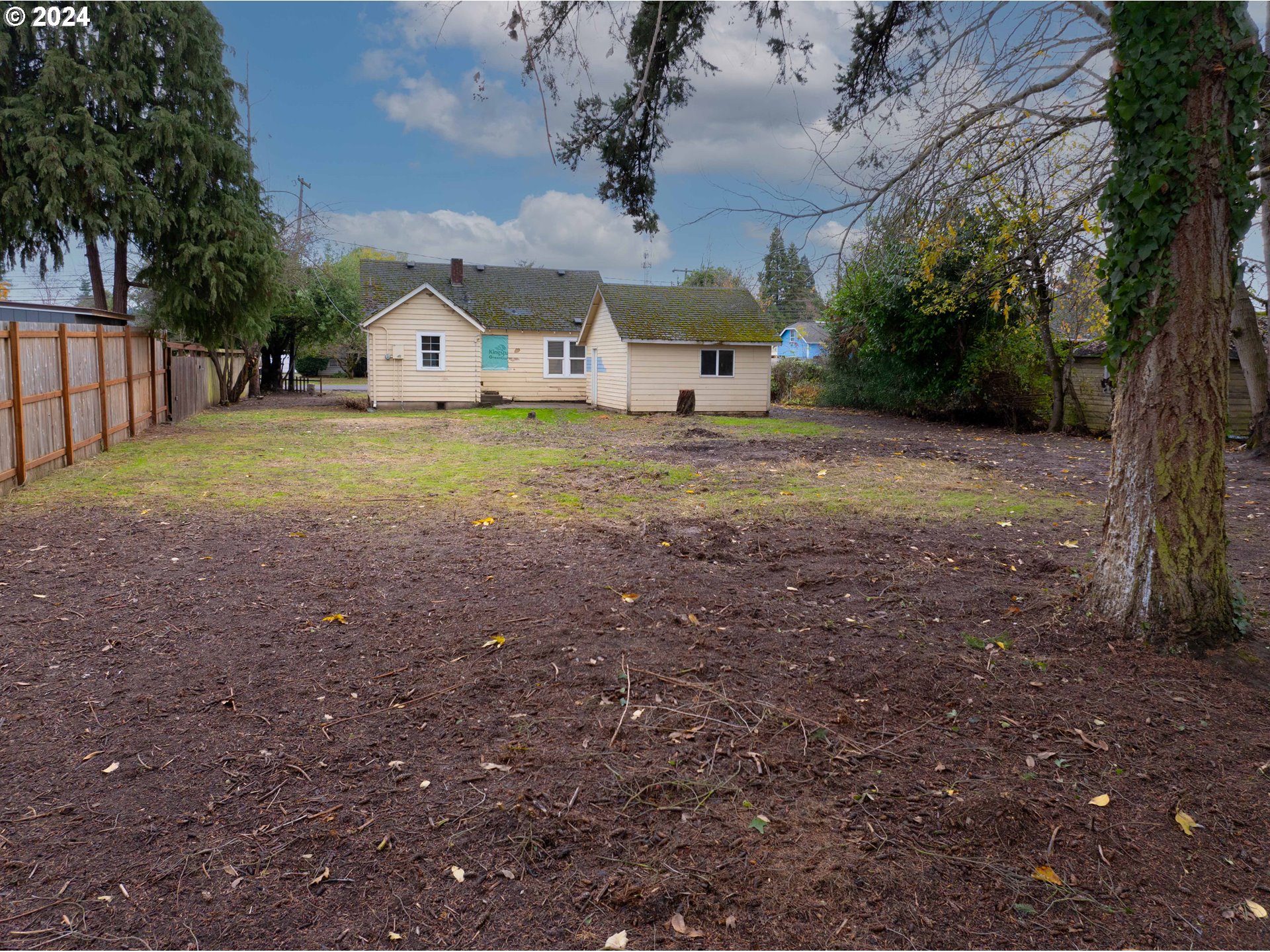 2947 Elmira Road Eugene, OR 97402 - Photo 25 of 29 a view of a house with backyard and tree